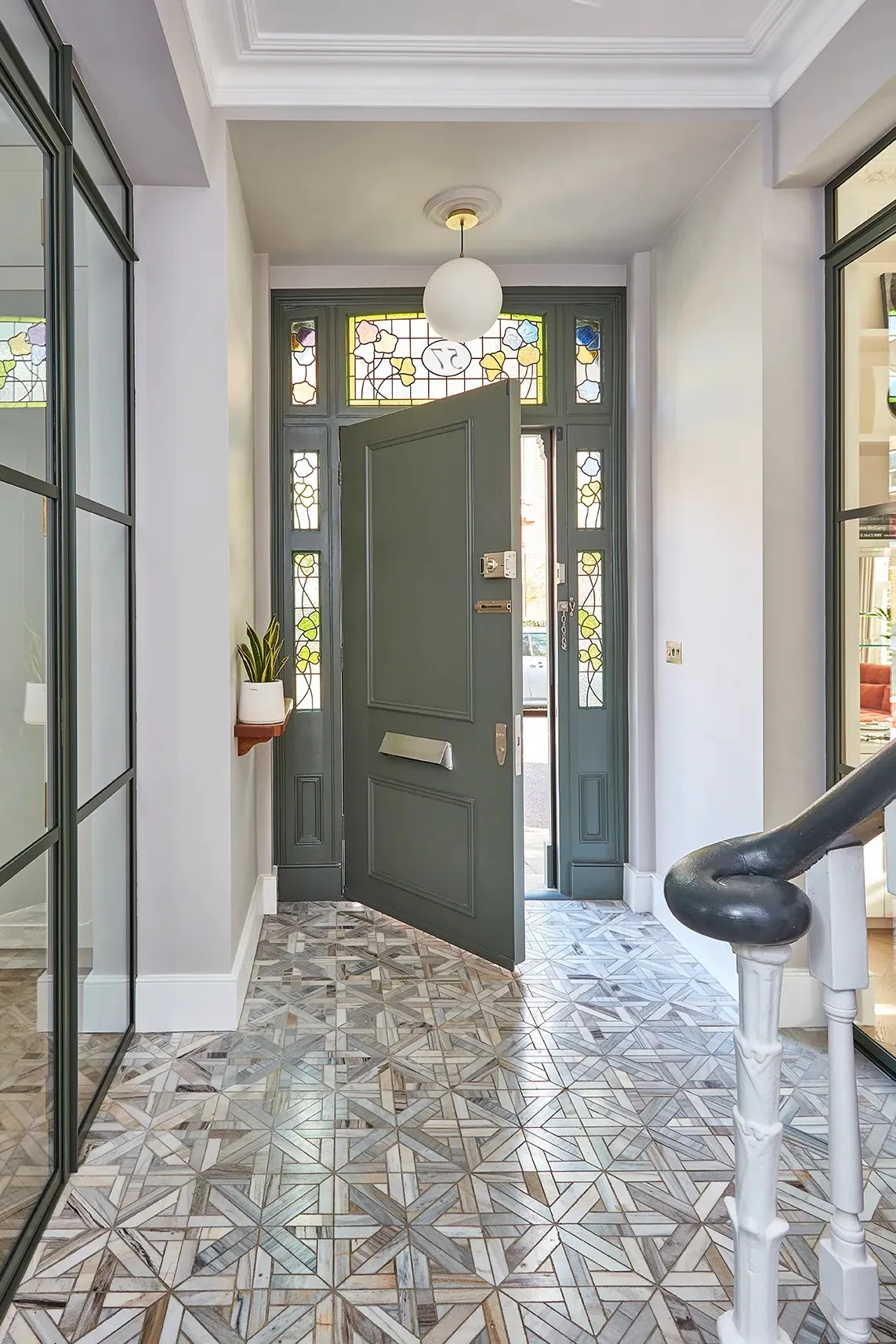 Entrance hall with restored stained-glass front door