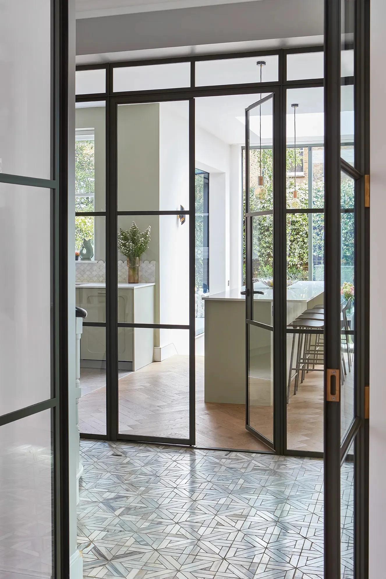 Crittall doors between the hall and kitchen