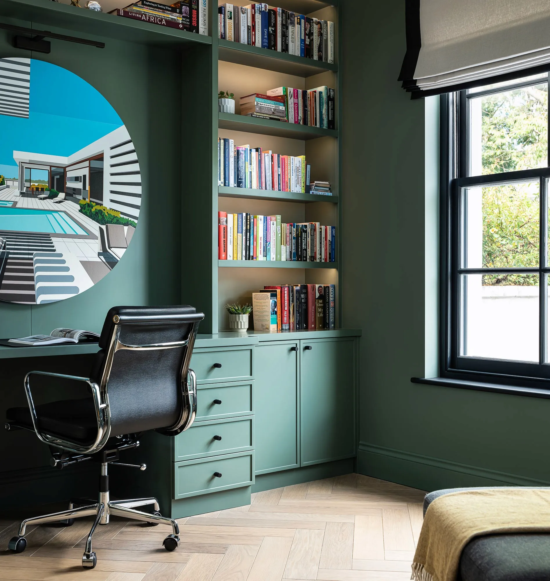 Green fitted desk and shelves in a bedroom