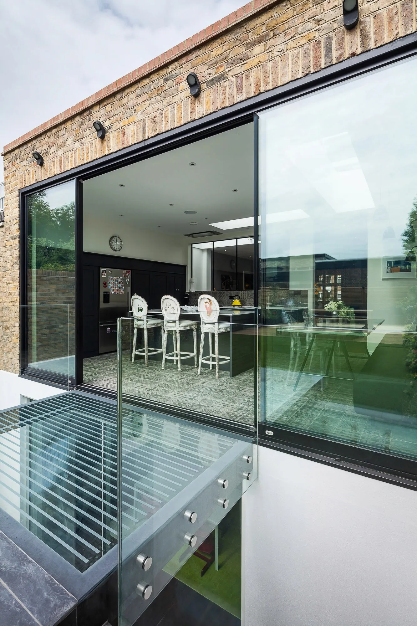 Glass box extension seen along the garden