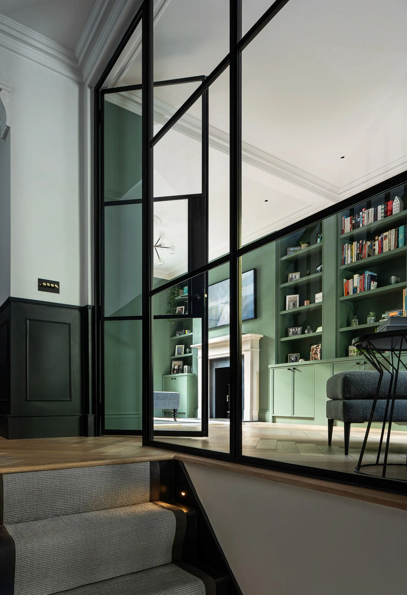 Crittall screen between the stair and reception room