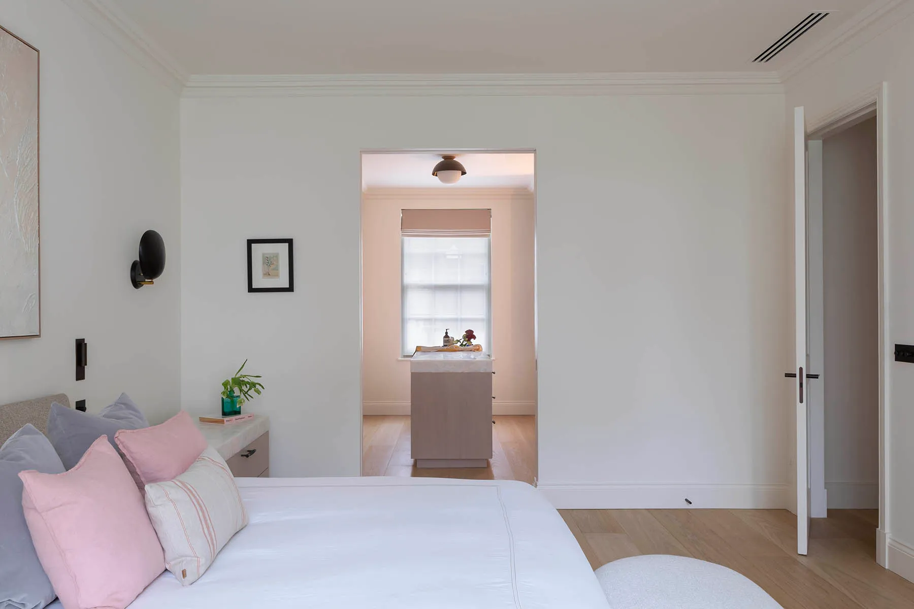 Bed with the dressing room beyond