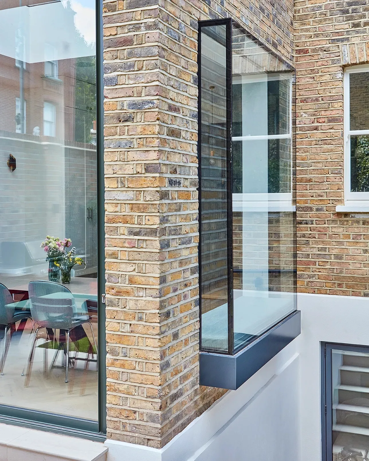 Brick pier and glazing above the basement lightwell