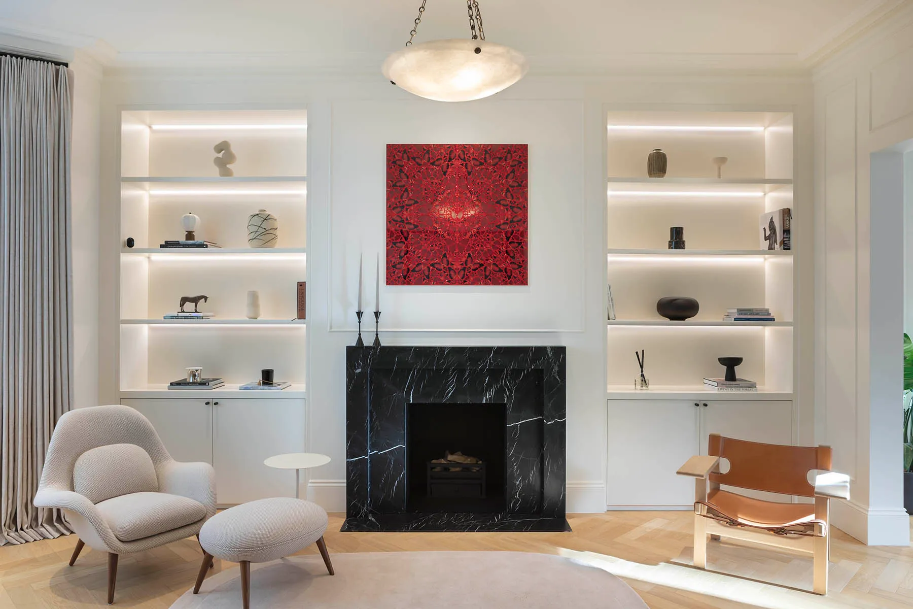 Lit alcoves either side of the marble fireplace