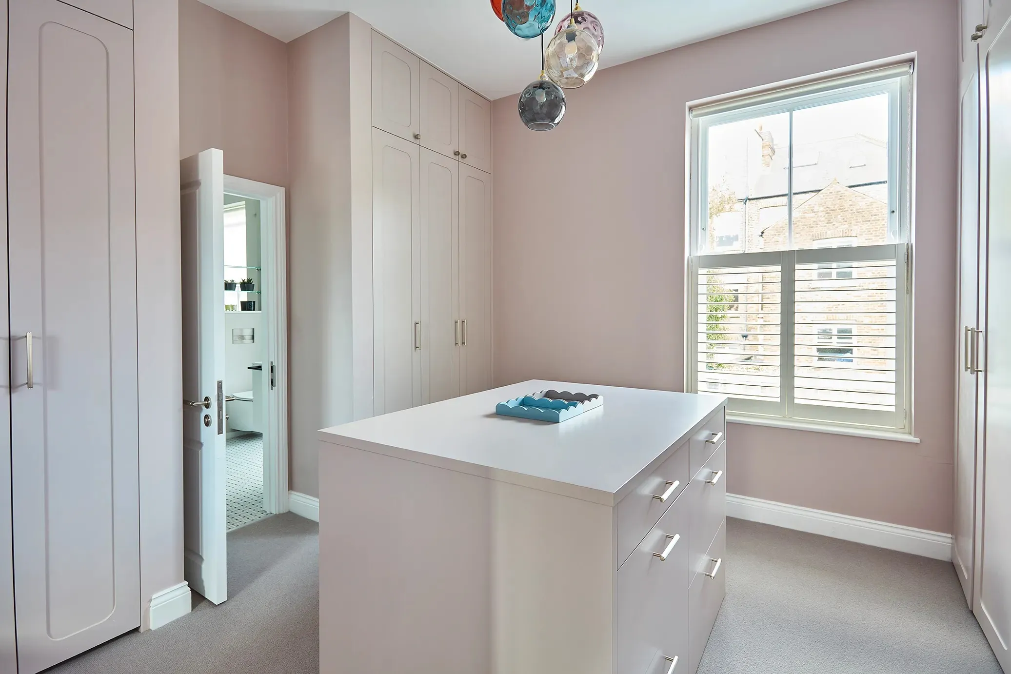 Dressing room island and fitted wardrobes