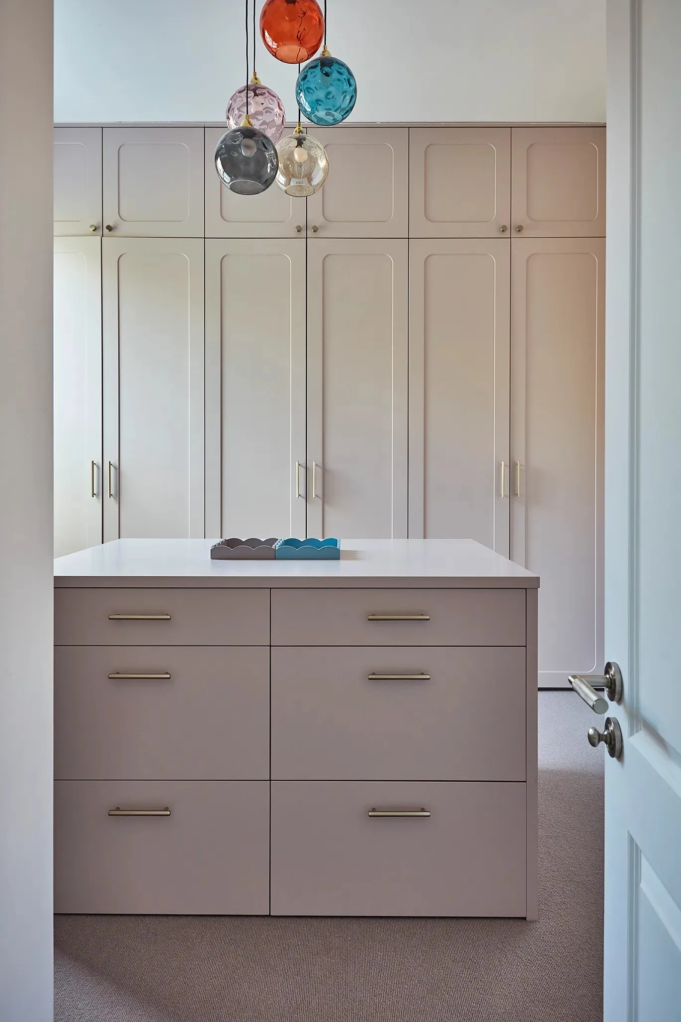 Drawer island under coloured glass pendants