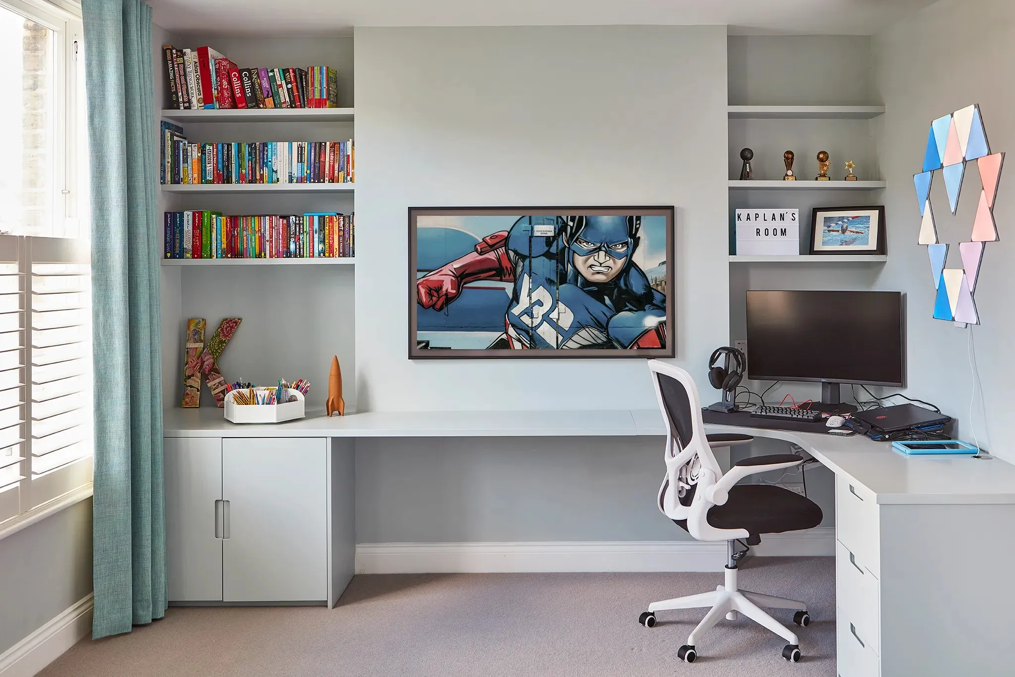 Fitted desk and bookshelves in a child's room