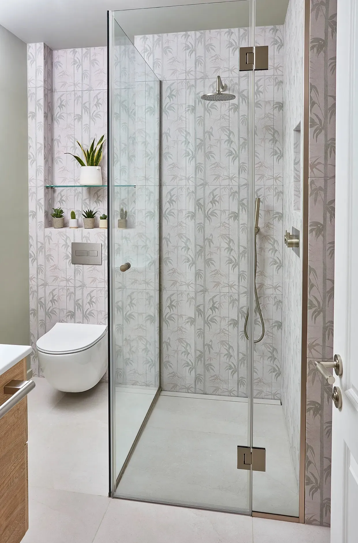Glazed shower against patterned wallpaper