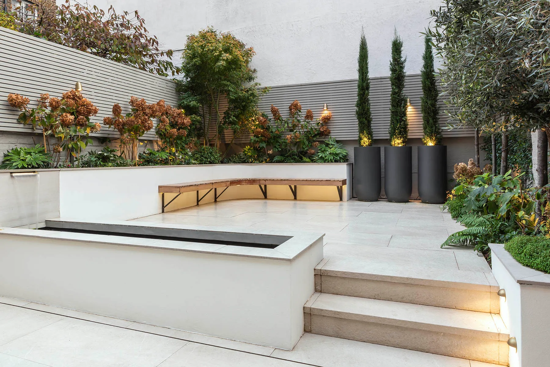 Stone terraces stepping up through the garden